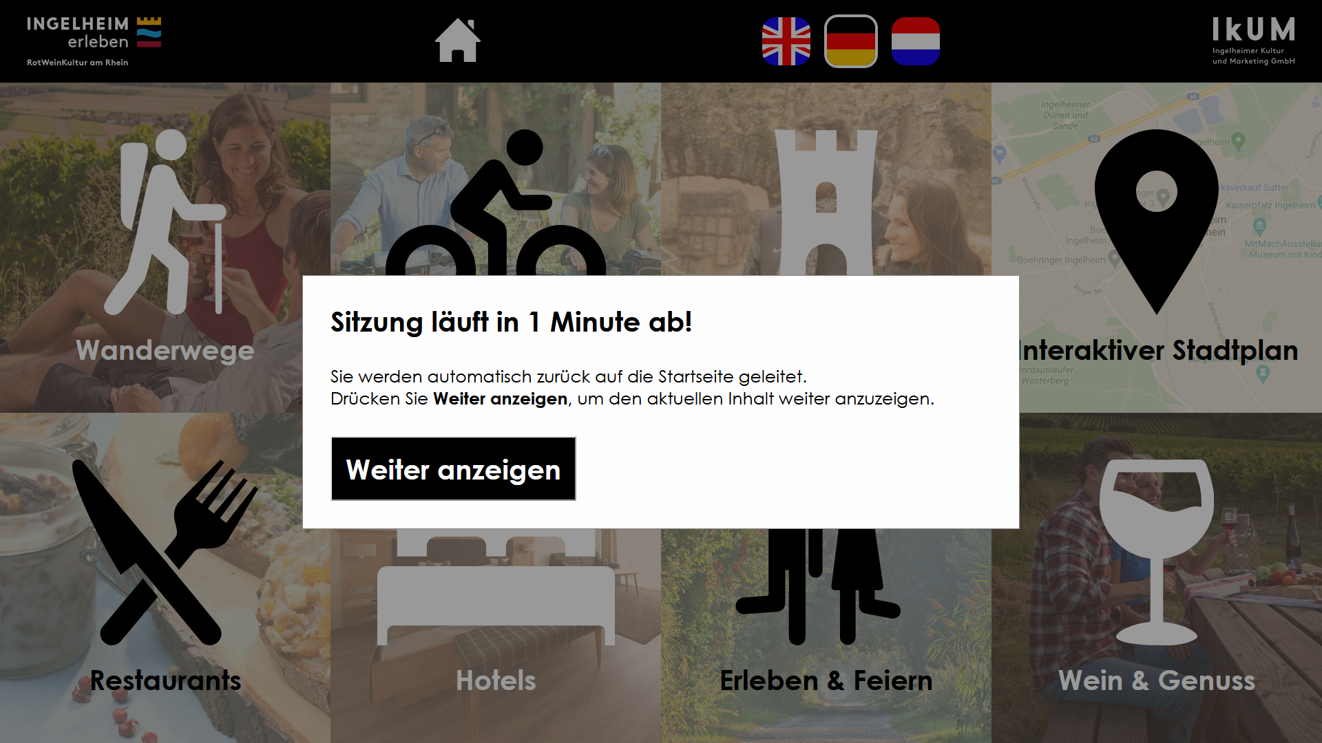 Image of an interface showing a logo of 'Ingelheim erleben', a homebutton, the flags of Great Britain, Germany and the Netherlands, a logo of 'IkUM' and a pop-up in the front saying: 'Sitzung läuft in 1 Minute ab!' with a button saying 'Weiter anzeigen'